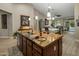 Open kitchen island with wine and snacks, open to the dining and living spaces at 19203 S 185Th Dr, Queen Creek, AZ 85142