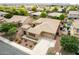 Spacious home with a two-car garage, well-manicured landscaping, and a welcoming driveway in a peaceful neighborhood at 1933 E Lafayette Ave, Gilbert, AZ 85298