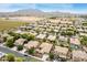 Aerial view of the neighborhood, showcasing lush landscaping, pools, and mountain views at 1933 E Lafayette Ave, Gilbert, AZ 85298