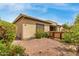Low maintenance backyard with gravel, a wood fence, and colorful flowers for a serene outdoor space at 1933 E Lafayette Ave, Gilbert, AZ 85298