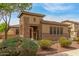 Charming single-Gathering home with decorative stonework, manicured landscaping, and gated entry at 1933 E Lafayette Ave, Gilbert, AZ 85298