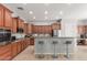 Bright kitchen featuring a breakfast bar with seating, wood cabinetry, and recessed lighting at 1933 E Lafayette Ave, Gilbert, AZ 85298