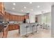 Spacious kitchen with bar seating, stainless steel appliances, and stylish lighting fixtures at 1933 E Lafayette Ave, Gilbert, AZ 85298
