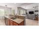 Kitchen with stainless steel appliances, granite countertops, and an open view to the living room at 1933 E Lafayette Ave, Gilbert, AZ 85298