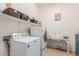 Laundry room featuring a washer, dryer, shelves and a counter with baskets at 1933 E Lafayette Ave, Gilbert, AZ 85298