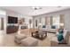 Spacious open-concept living room with natural light and access to the kitchen, staged virtually at 1933 E Lafayette Ave, Gilbert, AZ 85298