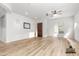 Bright living room with plenty of natural light and wood-look flooring, staged virtually to show size at 1933 E Lafayette Ave, Gilbert, AZ 85298