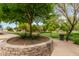 Scenic park view featuring a landscaped circular garden bed and sidewalks at 1933 E Lafayette Ave, Gilbert, AZ 85298