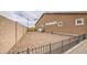 Low maintenance backyard with gravel, a fence, and a small shed at 19742 W Harrison St, Buckeye, AZ 85326
