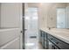 Bathroom featuring double sinks, modern cabinetry, and tub/shower combo at 19742 W Harrison St, Buckeye, AZ 85326