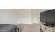 Bright bedroom with carpeted floor, TV, closet, and great natural light at 19742 W Harrison St, Buckeye, AZ 85326
