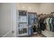 Walk-in closet featuring built-in shelving and organizers at 19742 W Harrison St, Buckeye, AZ 85326