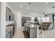 Open-concept kitchen featuring gray cabinetry, granite countertops, stainless appliances, and a central island at 19742 W Harrison St, Buckeye, AZ 85326