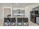 Contemporary kitchen with gray cabinets, granite countertops, a center island, and stainless appliances at 19742 W Harrison St, Buckeye, AZ 85326