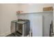 The laundry room has a washing machine, dryer, and freezer at 19742 W Harrison St, Buckeye, AZ 85326
