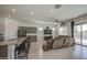 Bright and airy living room with bar seating, comfortable furnishings, and modern finishes at 19742 W Harrison St, Buckeye, AZ 85326