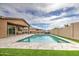 A backyard featuring a sparkling pool and lounge area perfect for outdoor relaxation at 19742 W Harrison St, Buckeye, AZ 85326