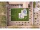 The meticulously designed backyard features lush turf, an outdoor spa, and stylish seating areas, perfect for entertaining at 20181 N Lauren Rd, Maricopa, AZ 85138