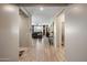 Hallway view into the living room with seamless flooring from end to end at 20181 N Lauren Rd, Maricopa, AZ 85138