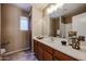 Bathroom with vanity, window and large mirror at 21549 N Backus Dr, Maricopa, AZ 85138