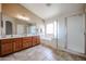 Bathroom featuring double vanity, bathtub and glass-enclosed shower at 21549 N Backus Dr, Maricopa, AZ 85138