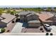 Two-story home features desert landscaping, an attached garage, and a concrete driveway on a sunny day at 21549 N Backus Dr, Maricopa, AZ 85138