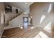 Spacious living room with staircase, high ceilings and wood-look floors at 21549 N Backus Dr, Maricopa, AZ 85138