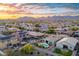 Stunning aerial view of a vibrant community with mountain backdrop and neighborhood pools at 21963 W Tonto St, Buckeye, AZ 85326