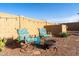 Cozy backyard with comfortable seating and string lights creating a relaxing outdoor retreat at 21963 W Tonto St, Buckeye, AZ 85326