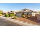 A lovely single-Gathering home featuring a tile roof, a two-car garage, and desert landscaping at 21963 W Tonto St, Buckeye, AZ 85326