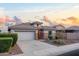 Beautiful home with a tile roof, a two-car garage, desert landscaping, and inviting curb appeal at 21963 W Tonto St, Buckeye, AZ 85326
