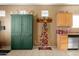 Charming kitchen with ample storage, butcher block countertops, and decorative shelving at 21963 W Tonto St, Buckeye, AZ 85326