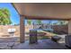 View of the backyard featuring a patio, grill, and trampoline at 22741 N Scott Dr, Maricopa, AZ 85138
