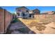Large backyard with brick wall fence and trampoline, perfect for outdoor activities at 22741 N Scott Dr, Maricopa, AZ 85138