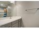 Bathroom featuring a modern vanity, mirror and modern fixtures, and shower/tub at 22741 N Scott Dr, Maricopa, AZ 85138