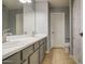 Bathroom featuring dual sinks, modern fixtures, and a neutral color palette at 22741 N Scott Dr, Maricopa, AZ 85138