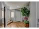 Inviting foyer with wood-like floors and a view of the staircase at 22741 N Scott Dr, Maricopa, AZ 85138