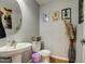 Cozy half bathroom with unique pedestal sink and stylish decor at 22741 N Scott Dr, Maricopa, AZ 85138
