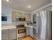 Well-lit kitchen with stainless steel appliances, a range, and a microwave at 22741 N Scott Dr, Maricopa, AZ 85138
