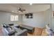 Bright living room featuring stylish furniture and a large flat-screen TV at 22741 N Scott Dr, Maricopa, AZ 85138