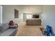 View of the living room, with gray walls, carpeted floor, and modern lighting at 22741 N Scott Dr, Maricopa, AZ 85138