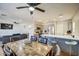 Open living space with a kitchen featuring stainless steel appliances and a dining table at 22741 N Scott Dr, Maricopa, AZ 85138