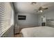 Bright bedroom with natural light, mirrored drawers and direct access to the bathroom at 22741 N Scott Dr, Maricopa, AZ 85138