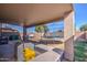 Covered patio featuring outdoor seating and a trampoline in the fenced backyard, great for entertaining at 22741 N Scott Dr, Maricopa, AZ 85138