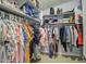 Spacious walk-in closet with ample shelving and hanging space for organized storage at 22741 N Scott Dr, Maricopa, AZ 85138