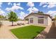 Backyard featuring a comfortable outdoor seating area, artificial lawn, and desert landscaping at 23046 N 88Th Way, Scottsdale, AZ 85255