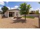 A spacious backyard offering a comfortable seating area, artificial lawn, and desert landscaping at 23046 N 88Th Way, Scottsdale, AZ 85255