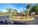 Desert Village entrance sign surrounded by cacti and desert foliage at 23046 N 88Th Way, Scottsdale, AZ 85255
