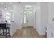 Bright open foyer with natural light and views of the kitchen and modern decor at 23046 N 88Th Way, Scottsdale, AZ 85255