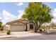 Attractive single-story home featuring a well-maintained yard and mature trees at 23046 N 88Th Way, Scottsdale, AZ 85255